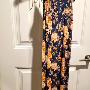 Stretchy dark blue and golden flower dress , has a high slit on the left thigh